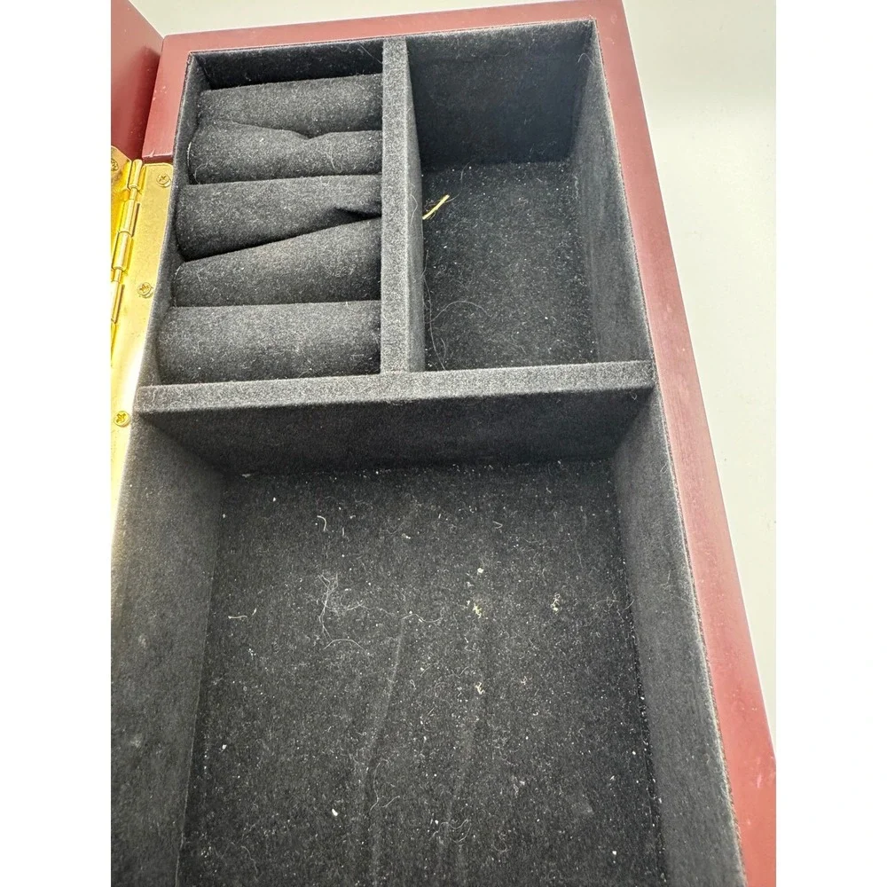 Elegant Wooden Jewelry Box with Ornate Metal Accents and Mirror